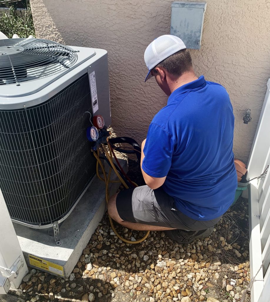 cool rays ac technician completing service call to home