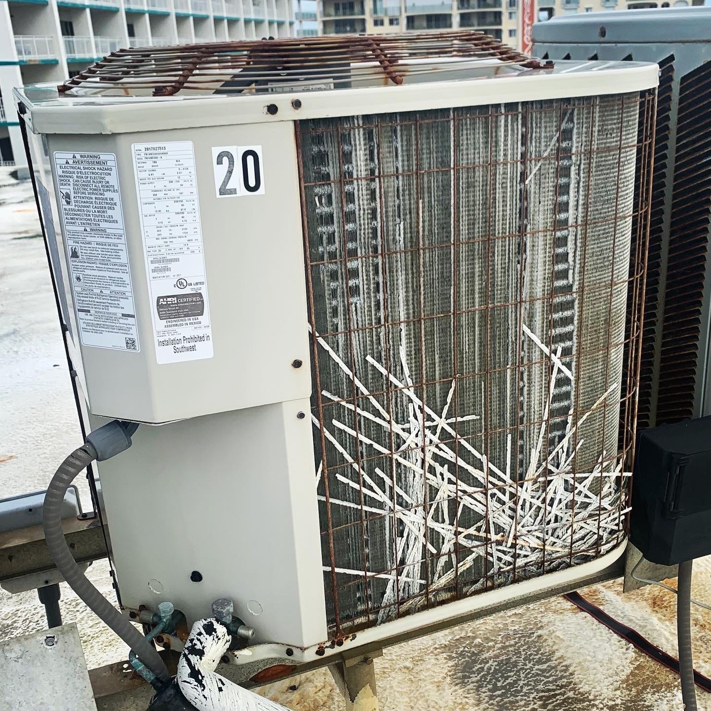 air conditioning unit with damaged fins from salt air corrosion
