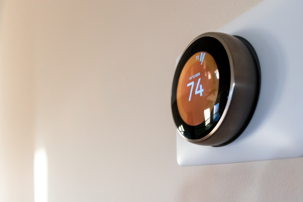 digital thermostat that says 74 degrees Fahrenheit