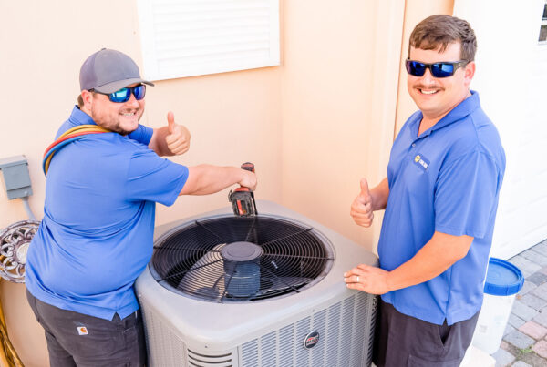 Two Cool Rays AC Technicians Working Outside a Merritt Home